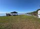 Dock on lakeside property with large grass area at 2263 Lake Reedy N Blvd, Frostproof, FL 33843