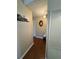 Hallway with wood floors and neutral colored walls at 2263 Lake Reedy N Blvd, Frostproof, FL 33843