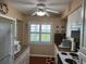 Bright kitchen features white cabinets, granite countertops, and stainless steel appliances at 2263 Lake Reedy N Blvd, Frostproof, FL 33843