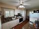 Bright kitchen featuring white cabinets, granite countertops, and modern appliances at 2263 Lake Reedy N Blvd, Frostproof, FL 33843