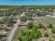 Aerial view of a home surrounded by trees and farmland featuring a fenced yard at 2391 Buck Board Trl, Lake Wales, FL 33898