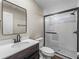 Updated bathroom with modern fixtures, stylish vanity, and sleek glass-enclosed shower at 2391 Buck Board Trl, Lake Wales, FL 33898