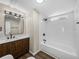 Bathroom featuring wood-look flooring, modern fixtures, and a combined tub and shower at 2391 Buck Board Trl, Lake Wales, FL 33898