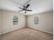 Corner bedroom with neutral paint and carpet at 2391 Buck Board Trl, Lake Wales, FL 33898