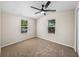 Bright bedroom with two windows and neutral decor at 2391 Buck Board Trl, Lake Wales, FL 33898