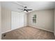 Bedroom includes fan, window, neutral paint, and carpet at 2391 Buck Board Trl, Lake Wales, FL 33898