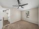 Bedroom featuring carpet, a window, and a ceiling fan at 2391 Buck Board Trl, Lake Wales, FL 33898