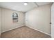 Cozy bedroom featuring neutral tones, soft carpeting, and a bright window at 2391 Buck Board Trl, Lake Wales, FL 33898