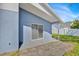 Cozy back porch perfect for relaxing, with sliding glass doors and an adjacent stone patio at 2616 Huntington Ct, Kissimmee, FL 34743