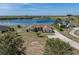 Scenic aerial view of a charming home with a long driveway and a serene lake backdrop at 2656 S Scenic Hwy, Lake Wales, FL 33898