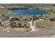 Expansive aerial shot featuring a home with a long driveway and large lake at 2656 S Scenic Hwy, Lake Wales, FL 33898