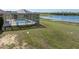 Screened-in pool with large backyard and lake at 2656 S Scenic Hwy, Lake Wales, FL 33898