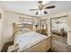 Bedroom with a ceiling fan, mirrored closet doors, and a carpeted floor at 2656 S Scenic Hwy, Lake Wales, FL 33898