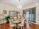 Formal dining room featuring a chandelier, and a large china cabinet at 2656 S Scenic Hwy, Lake Wales, FL 33898