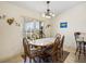 Bright dining room with a view and a chandelier at 2656 S Scenic Hwy, Lake Wales, FL 33898