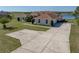 Expansive driveway leading to a beautiful single-story home with a well-maintained lawn at 2656 S Scenic Hwy, Lake Wales, FL 33898