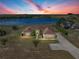 Aerial view of home featuring mature landscaping, well manicured lawn and circular driveway at 2656 S Scenic Hwy, Lake Wales, FL 33898