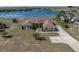 Aerial view of home featuring mature landscaping, well manicured lawn, and circular driveway at 2656 S Scenic Hwy, Lake Wales, FL 33898