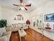 Bright living room with hardwood floors, neutral walls, and lots of natural light at 2656 S Scenic Hwy, Lake Wales, FL 33898