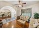 Bright living room featuring hardwood floors and neutral walls, leading to dining room at 2656 S Scenic Hwy, Lake Wales, FL 33898