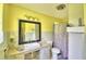 Well-lit bathroom featuring a granite countertop, framed mirror, and patterned shower curtain at 301 S Clinch Lake Blvd, Frostproof, FL 33843