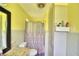 A tidy bathroom with a functional layout, shower and essential amenities at 301 S Clinch Lake Blvd, Frostproof, FL 33843