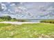 A picturesque beachfront with white sand and lake views, perfect for relaxation and waterfront living at 301 S Clinch Lake Blvd, Frostproof, FL 33843