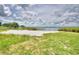 White sand community beach area providing community access to the lake at 301 S Clinch Lake Blvd, Frostproof, FL 33843