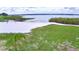 Community lakefront beach access with white sand and green grass at 301 S Clinch Lake Blvd, Frostproof, FL 33843