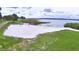 Community waterfront access with a sandy beach and picturesque views of the lake at 301 S Clinch Lake Blvd, Frostproof, FL 33843
