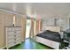 A spacious bedroom with neutral colors, a comfy bed and a sliding glass door at 301 S Clinch Lake Blvd, Frostproof, FL 33843