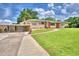 Lovely single-story home featuring a carport, attached garage, and a well-manicured green lawn at 301 S Clinch Lake Blvd, Frostproof, FL 33843