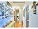 Bright hallway features wooden floors, unique decor, and inviting ambiance at 301 S Clinch Lake Blvd, Frostproof, FL 33843