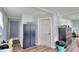 Functional hallway with storage cabinets, doors and wood-look vinyl floors at 301 S Clinch Lake Blvd, Frostproof, FL 33843