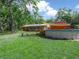 Spacious backyard featuring an above-ground pool and ample greenery at 3123 Mar Lisa Cove Rd, Lake Wales, FL 33898