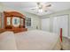 Bright bedroom with a wooden dresser, double closets, and neutral decor at 3123 Mar Lisa Cove Rd, Lake Wales, FL 33898