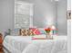 A serene bedroom featuring a comfortable bed, a window, and soft lighting for a relaxing ambiance at 3123 Mar Lisa Cove Rd, Lake Wales, FL 33898