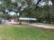 Charming brick ranch home with large yard, mature trees, and detached garage/workshop at 3123 Mar Lisa Cove Rd, Lake Wales, FL 33898