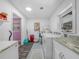 Bright laundry room with modern appliances, countertop space, and ample storage at 3123 Mar Lisa Cove Rd, Lake Wales, FL 33898