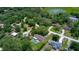 Gorgeous aerial view of this property features a large lot with mature trees and a beautiful in-ground pool at 3567 Red Oak Ct, Lake Wales, FL 33898