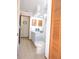 Bathroom with a double sink vanity and a door leading to another room at 3567 Red Oak Ct, Lake Wales, FL 33898