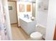 Bathroom with a double sink vanity and a door leading to another room at 3567 Red Oak Ct, Lake Wales, FL 33898