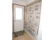 Bathroom with a door to the left and a shower with lighthouse curtain to the right at 3567 Red Oak Ct, Lake Wales, FL 33898