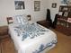 Bedroom featuring a quilt, wood furnishings, and room for storage at 3567 Red Oak Ct, Lake Wales, FL 33898