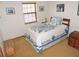 Comfortable bedroom with natural light and a cozy quilt on the bed at 3567 Red Oak Ct, Lake Wales, FL 33898