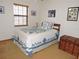 Comfortable bedroom with a neatly made bed, natural light, and classic decor elements at 3567 Red Oak Ct, Lake Wales, FL 33898