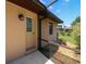 Exterior of the home with a view of the grassy yard and a stone garden at 3567 Red Oak Ct, Lake Wales, FL 33898
