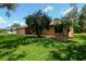 Inviting single-story home with mature landscaping and a two-car garage at 3567 Red Oak Ct, Lake Wales, FL 33898