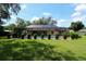 Screened pool with well maintained landscaping and plenty of room to enjoy the outdoor space at 3567 Red Oak Ct, Lake Wales, FL 33898