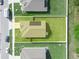 Aerial view highlighting property lines, solar panels, and large green backyard at 4833 Drake Ave, Lakeland, FL 33811